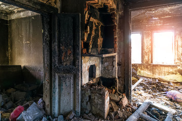 Burnt old rural house interior. Consequences of fire