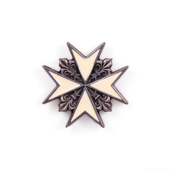 Souvenir  (magnet) in the form of a Maltese cross isolated on white background