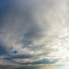 Fantastic clouds against blue sky, square
