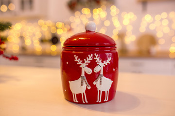 Christmas decor in kitchen. Christmas tableware. Christmas cooking utensils. Bright interior of New...