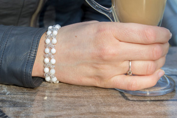 Obraz na płótnie Canvas Fashion accessories. Jewelry on female hand. Gemstone bracelets. Natural stones beads.
