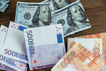 Obraz na płótnie Canvas rubles and euros together, dollars in the background