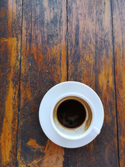 Cup of coffee on the wood table.