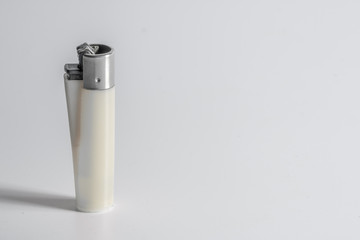 one White lighter isolated on White background with space for text