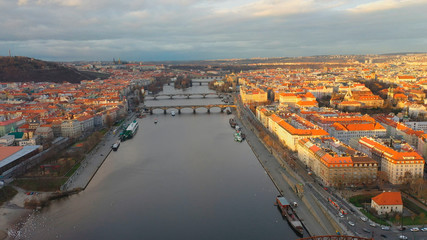 Aerial view of Podskali area under Vysehrad castle at sunset light, view of Prague, Czech Republic