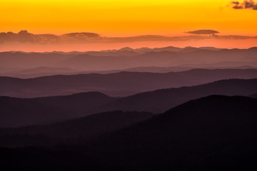 Splendid mountain sunrise. Mountains silhouettes on a beauty background. Bieszczady Mountains Poland.