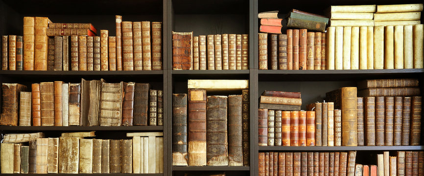 old books on wooden shelf