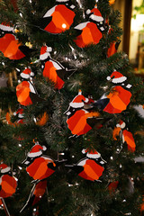 Christmas decorations on the Christmas tree. Bullfinches.
