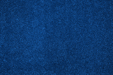 Festive abstract blue glitter background. Colour of year classic blue.