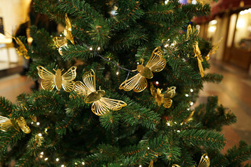 Christmas decorations on the Christmas tree. Butterflies.