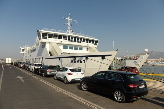 Split, Croatia - August 19, 2017: Cars waiting for ferry boarding in port of Split, Croatia.