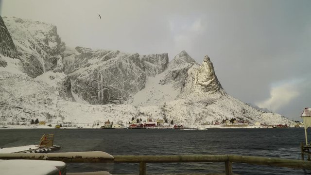 timelapse of a snowy landscape in a Norwegian fjord with blown snow