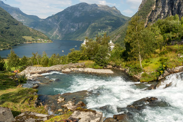 Fototapeta na wymiar Majestic waterfall in the Geiranger area, located in Norway