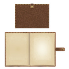 notebook in brown leather stitched cover with a strap on the clasp. closed and open version with yellowed paper pages.
