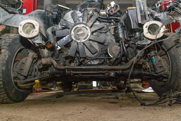 Fototapeta premium Semi-disassembled car after an accident close-up on the auto Assembly. Concept of car service, auto Assembly, used auto parts