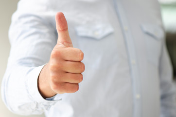 Businessman show thumbs up