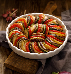 Vegetable tian, traditional Provencal vegetable casserole, close-up, delicious and nutritious vegetarian meal - obrazy, fototapety, plakaty