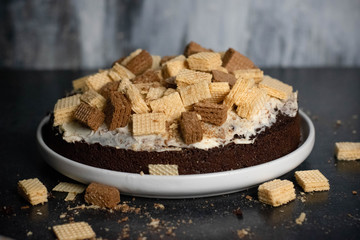 Chocolate cake with cookies on top