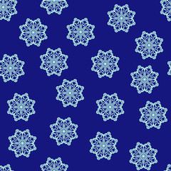 seamless pattern of adorable winter snowflakes in the shape of a flower on blue . Can be used as wrapping paper, background, fabric print, web page backdrop, wallpape