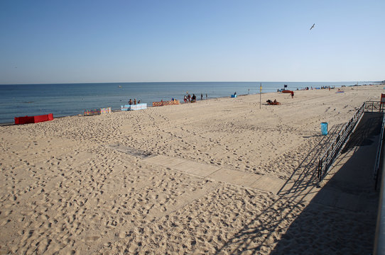 beach with chairs and umbrellas on beach