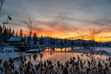 Pond and House with Snowy Sunset