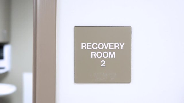 Signs on wall in medical office hospital. slider movement of establishing shot for room inside doctors office.