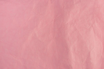  pink crumpled leather background close-up
