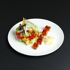 Dishes of traditional Russian cuisine. Restaurant serving. Black background.