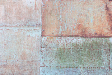 Rusty metal texture or background, rusted metal sheets with rivets
