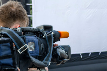 the cameraman make film captures the events on the street live television broadcast