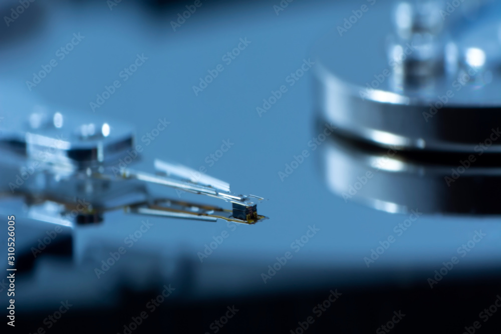 Poster disassembled hard drive from the computer, hdd with mirror effect. opened hard drive from the comput
