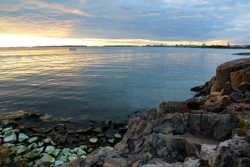 Beautiful summer sunset on rocky beach