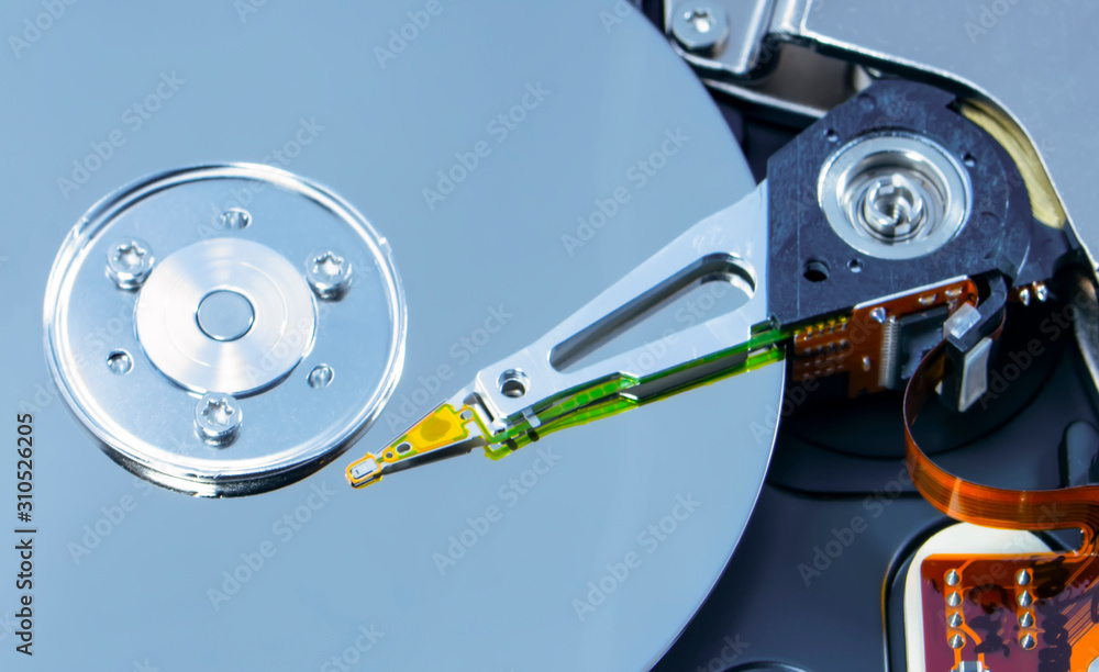 Poster disassembled hard drive from the computer, hdd with mirror effect. opened hard drive from the comput