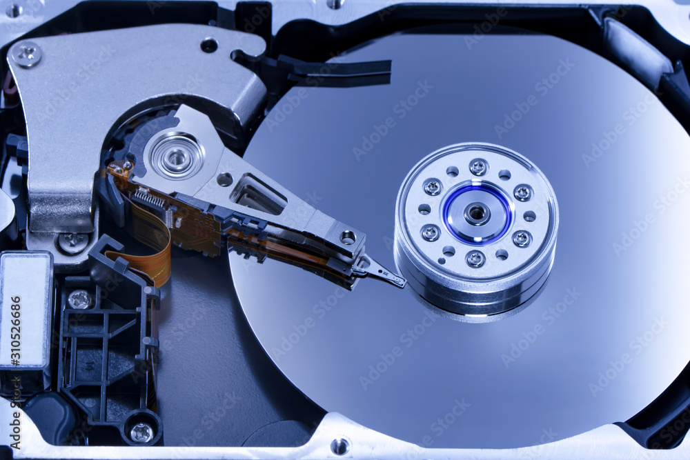 Poster disassembled hard drive from the computer, hdd with mirror effect. opened hard drive from the comput