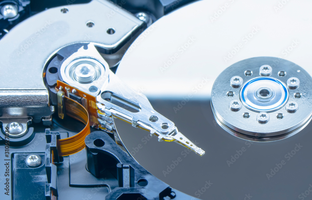 Poster disassembled hard drive from the computer, hdd with mirror effect. opened hard drive from the comput