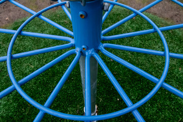 Closeup of blue metal wheel construction