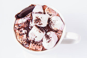 Cup of hot chocolate with marshmallows on a white background