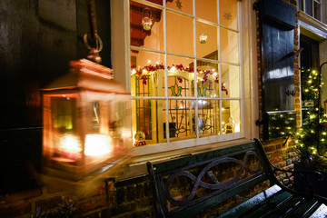 Obraz premium Window with Christmas lighting in winter time and atmospheric decoration