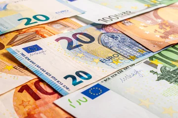 Fotobehang Euro money – Euro cash background. Background from several euro paper cash. Banknote texture. Financial concept of money. © Andrii A