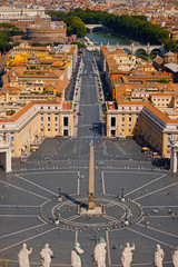 Vatican City view from the top of St. Peter's Basilica in Rome, Italy. Looking down over Piazza San Pietro in Vatican. Saint Peter's Square and aerial view of Roma. Famous travel destination.