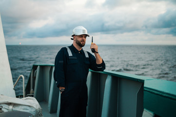 Marine Deck Officer or Chief mate on deck of offshore vessel or ship , wearing PPE personal...