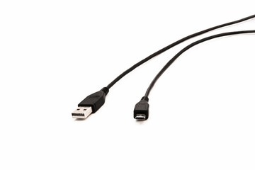 Black USB cable on white background. USB and USB-mini cable connectors close-up.Black USB cable on white background. USB and USB-mini cable connectors close-up.