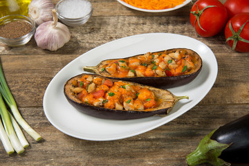 Eggplant stuffed with meat and vegetables and baked with cheese. Selected focus.