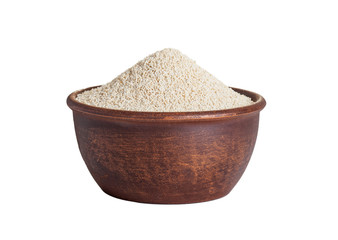 amaranth seeds in a clay plate isolated on white background