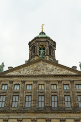 Fototapeta na wymiar Top part of The Royal Palace in Dam Square, Amsterdam, Netherlands. Vertical