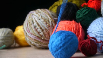 Unwinding A Ball Of Blue Yarn