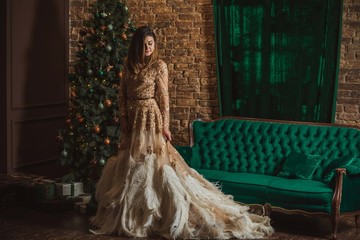 Naklejka premium Magical night, arabic woman in feathers evening dolden sparkle dressat Christmas atmosphere