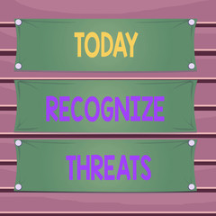 Obraz premium Conceptual hand writing showing Recognize Threats. Concept meaning potential to cause serious harm to a computer system Wooden panel attached nail on colorful background plank wood