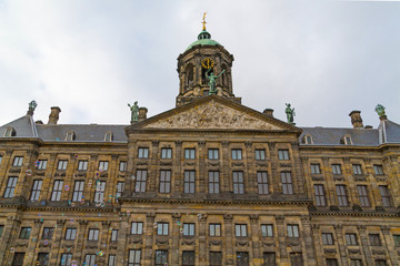 Fototapeta na wymiar Interesting view of top part of The Royal Palace in Dam Square with bubble blower, Amsterdam, Netherlands.