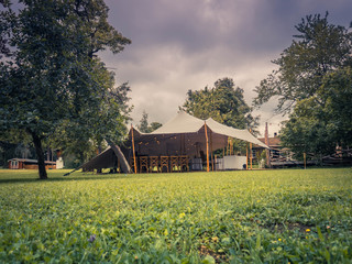 Image of huge white tent for a wedding event in the nature